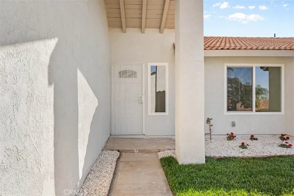 a house with garden in front of it