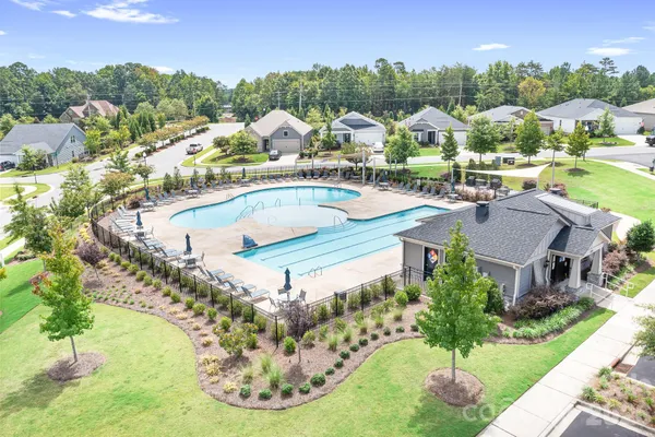 a view of a swimming pool with a yard