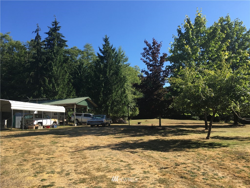 93 A Miles Road Port Angeles, WA 98362 - Photo 1 of 12 a view of swimming pool with trees