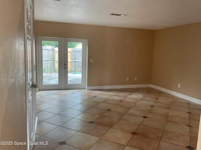 a view of an empty room and window
