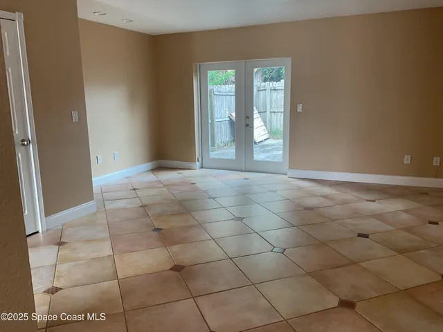 a view of an empty room and window