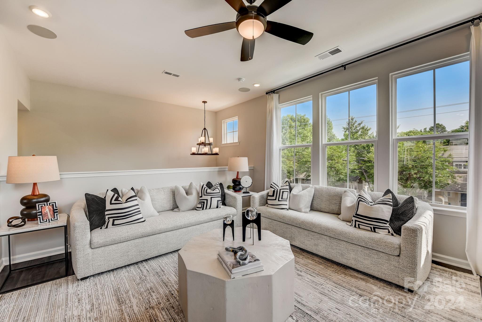 109 Goodson Place Davidson, NC 28036 - Photo 17 of 40 a living room with furniture and a large window
