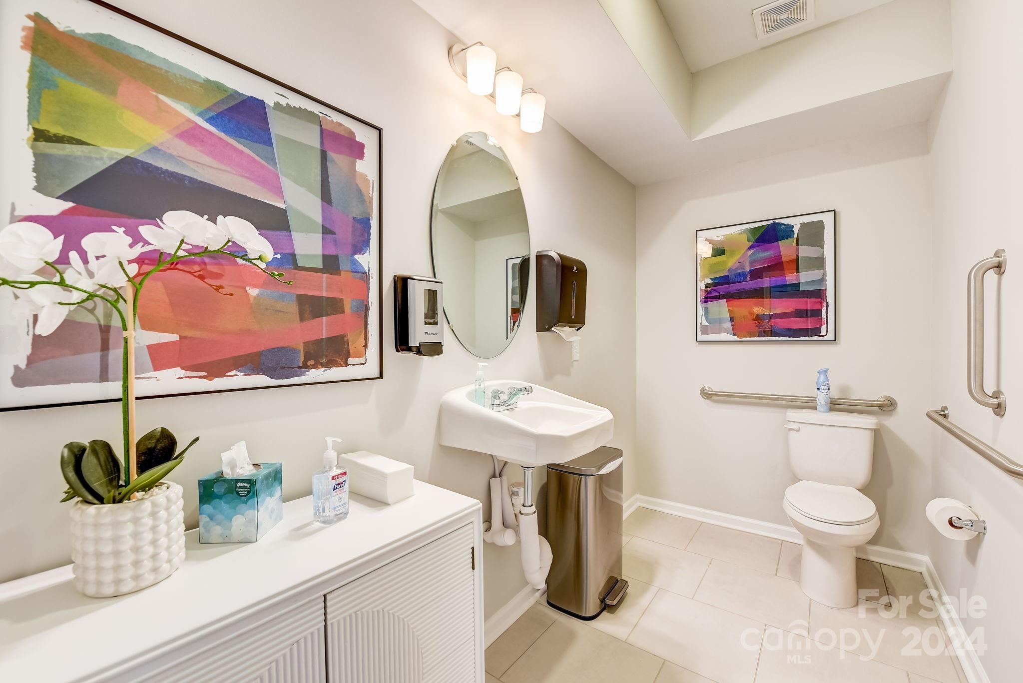 109 Goodson Place Davidson, NC 28036 - Photo 23 of 40 a bathroom with a sink mirror and toilet