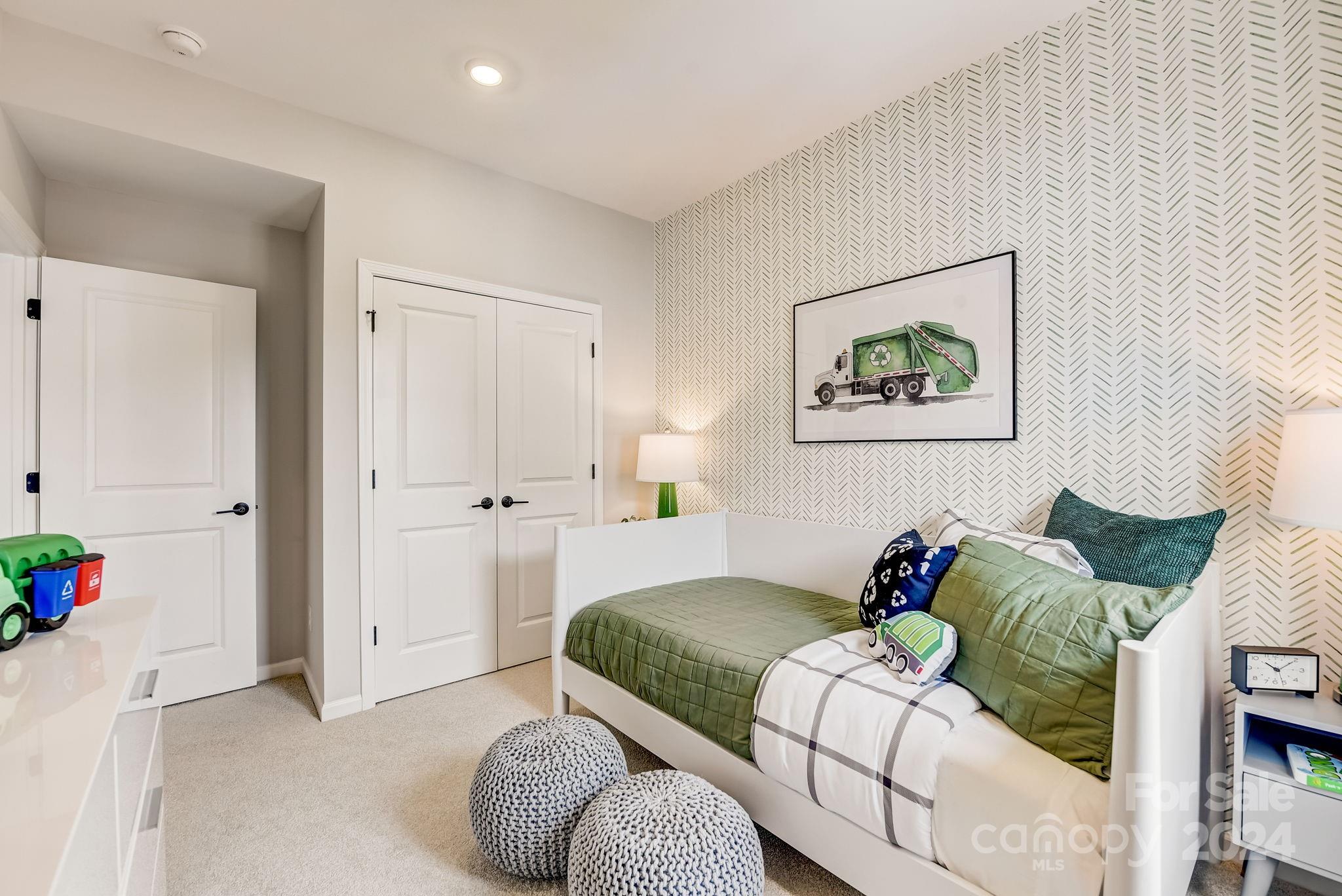 109 Goodson Place Davidson, NC 28036 - Photo 33 of 40 a bedroom with a bed and a couch