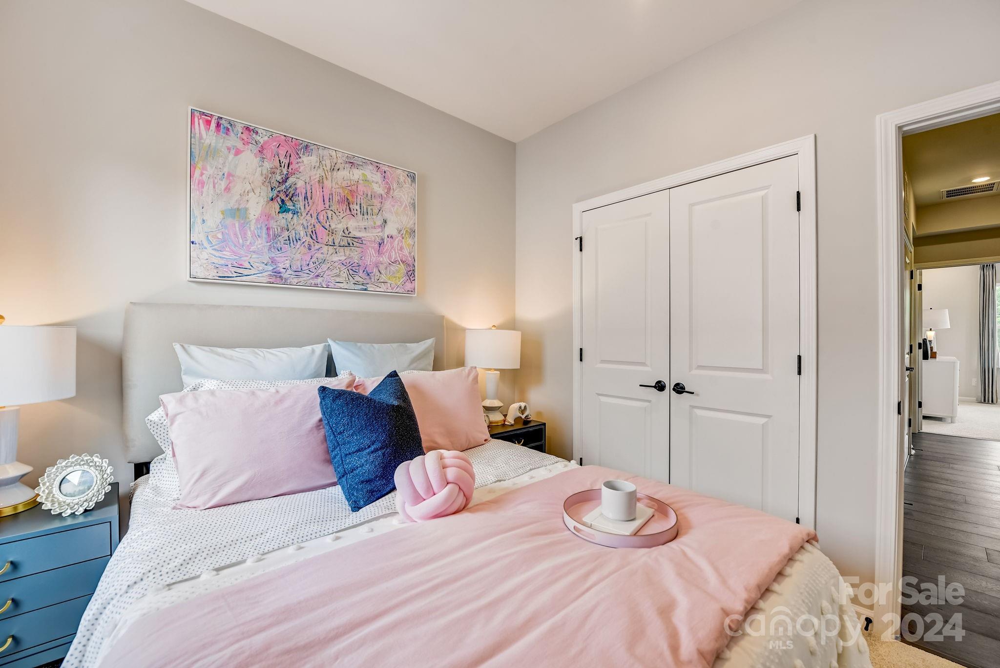109 Goodson Place Davidson, NC 28036 - Photo 35 of 40 a bedroom with a bed and a painting on the wall