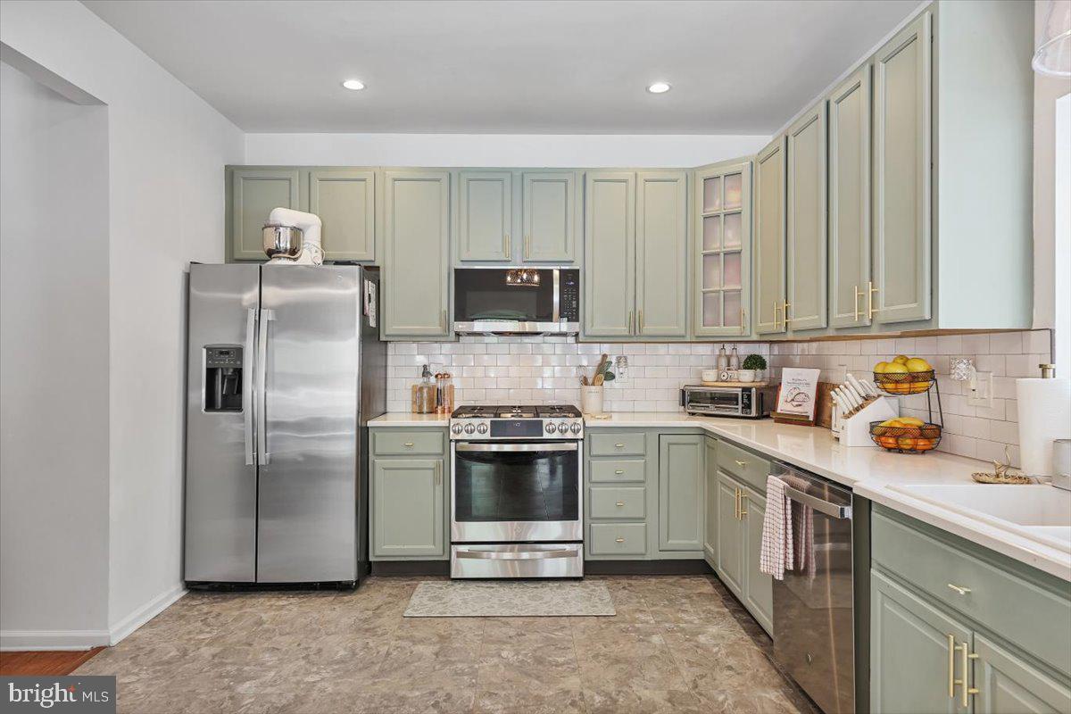 201 Prancer Road Egg Harbor Township, NJ 08234 - Photo 14 of 66 a kitchen with stainless steel appliances granite countertop a stove a sink dishwasher a refrigerator and a microwave