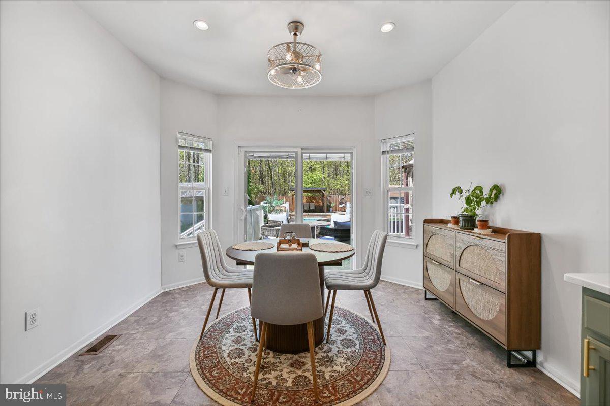 201 Prancer Road Egg Harbor Township, NJ 08234 - Photo 16 of 66 a dining room with furniture a window and wooden floor