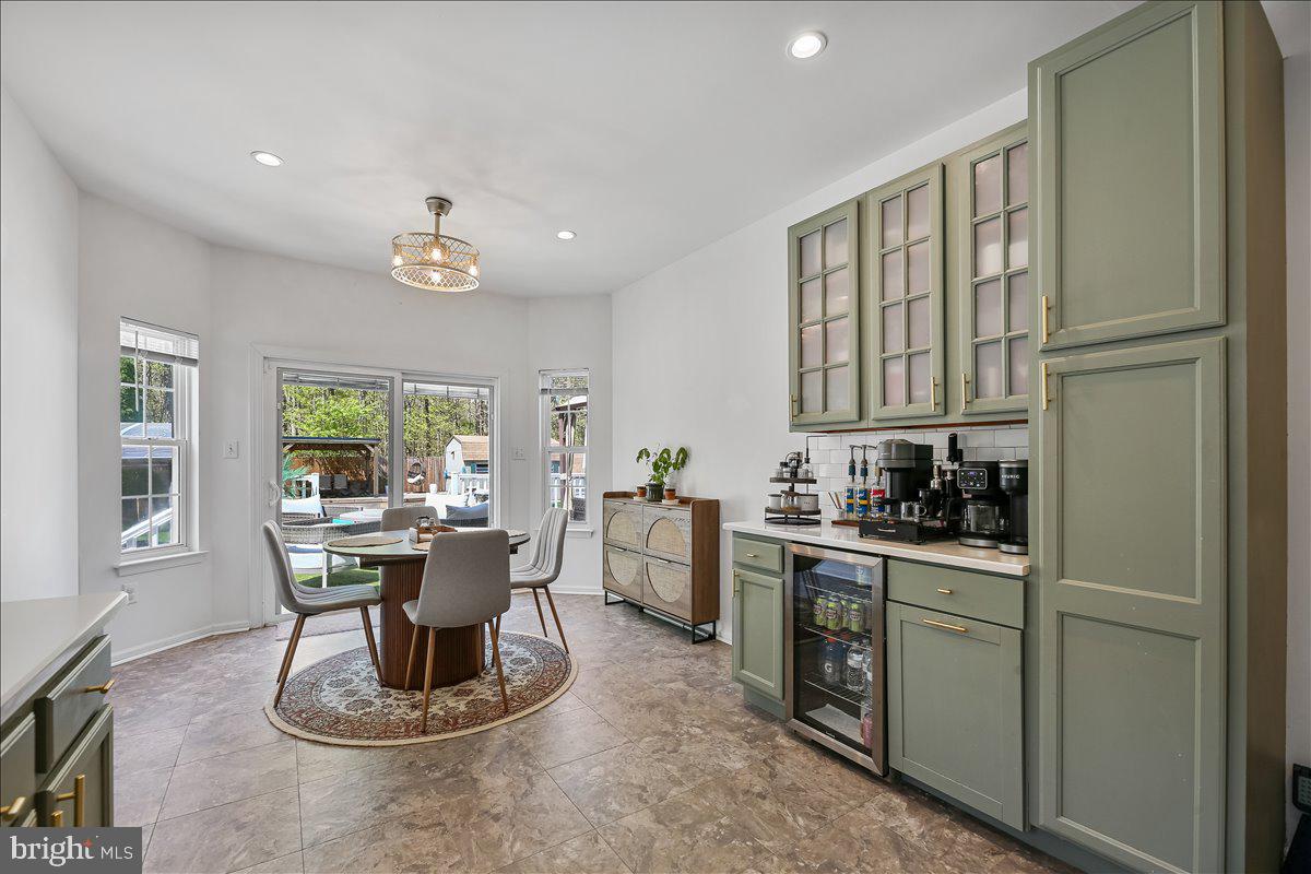 201 Prancer Road Egg Harbor Township, NJ 08234 - Photo 17 of 66 a kitchen with a refrigerator and a stove