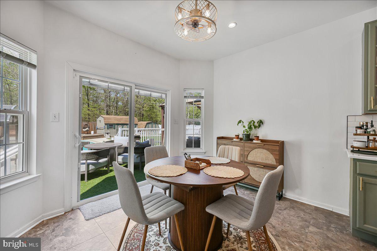 201 Prancer Road Egg Harbor Township, NJ 08234 - Photo 18 of 66 a view of a dining room with furniture window and outside view