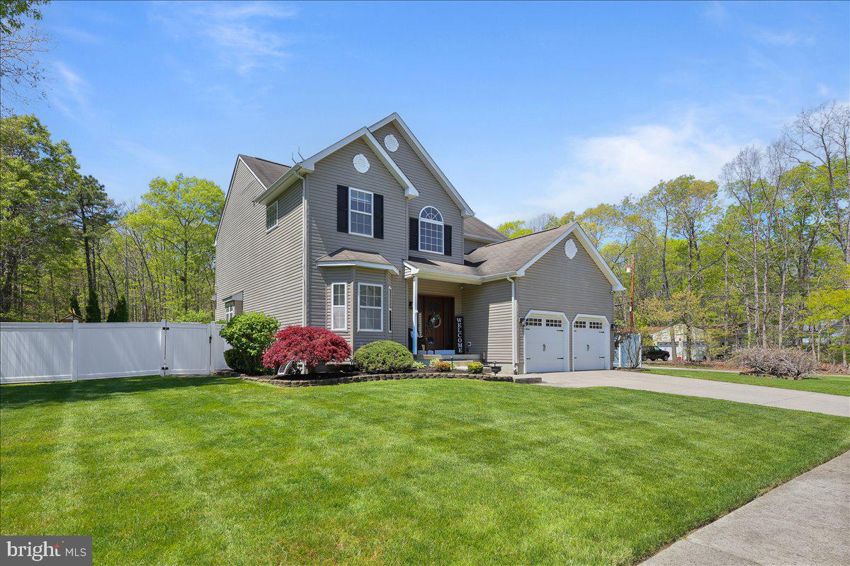 201 Prancer Road Egg Harbor Township, NJ 08234 - Photo 2 of 66 a front view of house with yard and green space