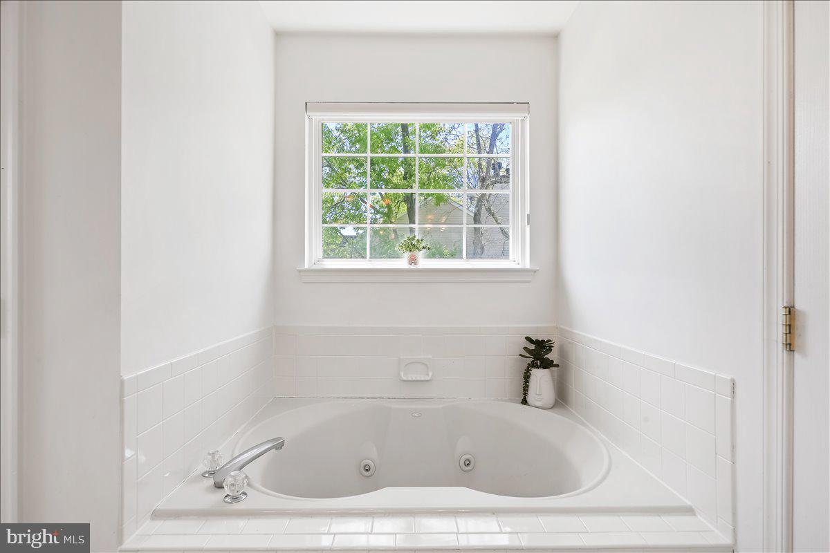 201 Prancer Road Egg Harbor Township, NJ 08234 - Photo 30 of 66 a white bath tub sitting next to a window
