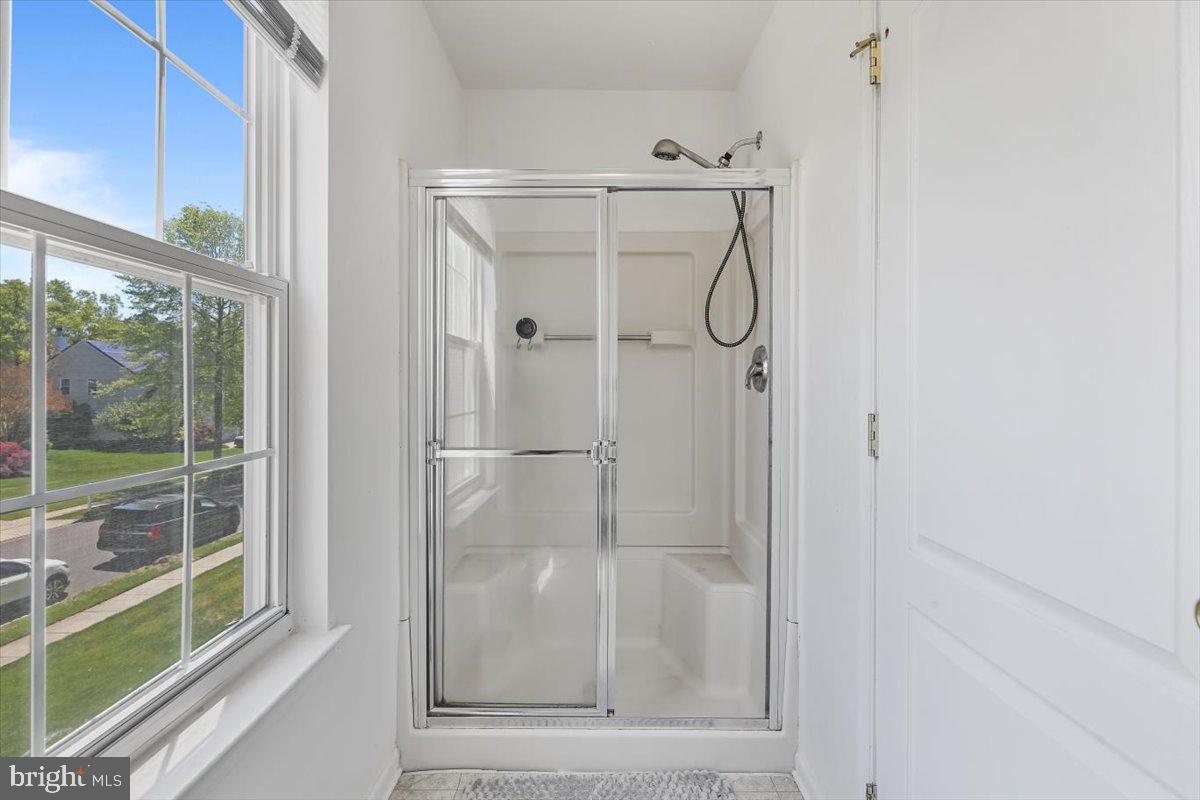 201 Prancer Road Egg Harbor Township, NJ 08234 - Photo 32 of 66 a bathroom with a glass shower door