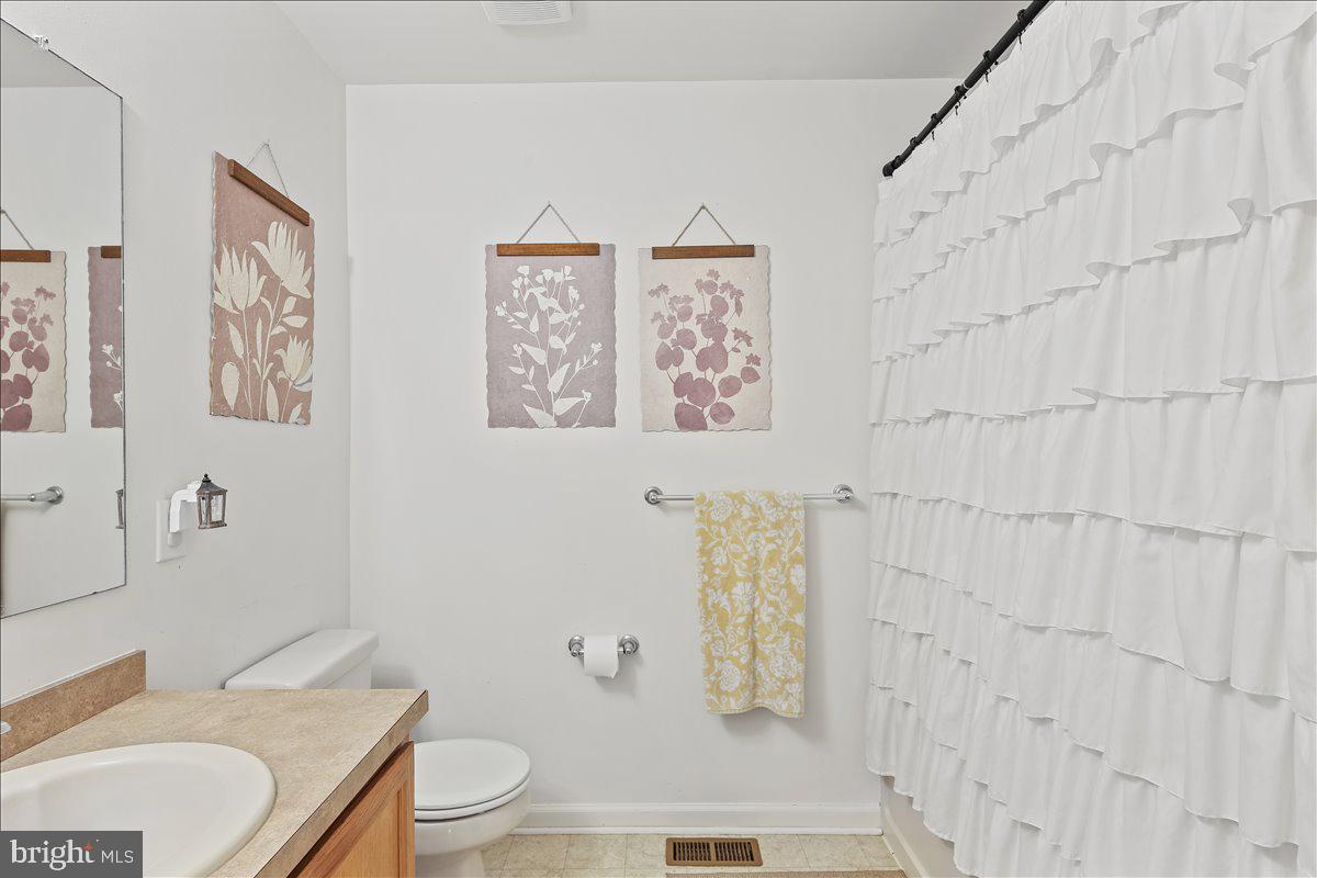 201 Prancer Road Egg Harbor Township, NJ 08234 - Photo 34 of 66 a bathroom with a granite countertop toilet and a sink