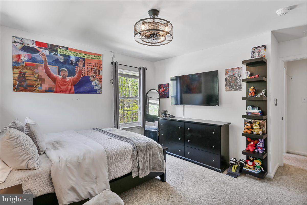 201 Prancer Road Egg Harbor Township, NJ 08234 - Photo 38 of 66 a bedroom with a bed and a flat screen tv