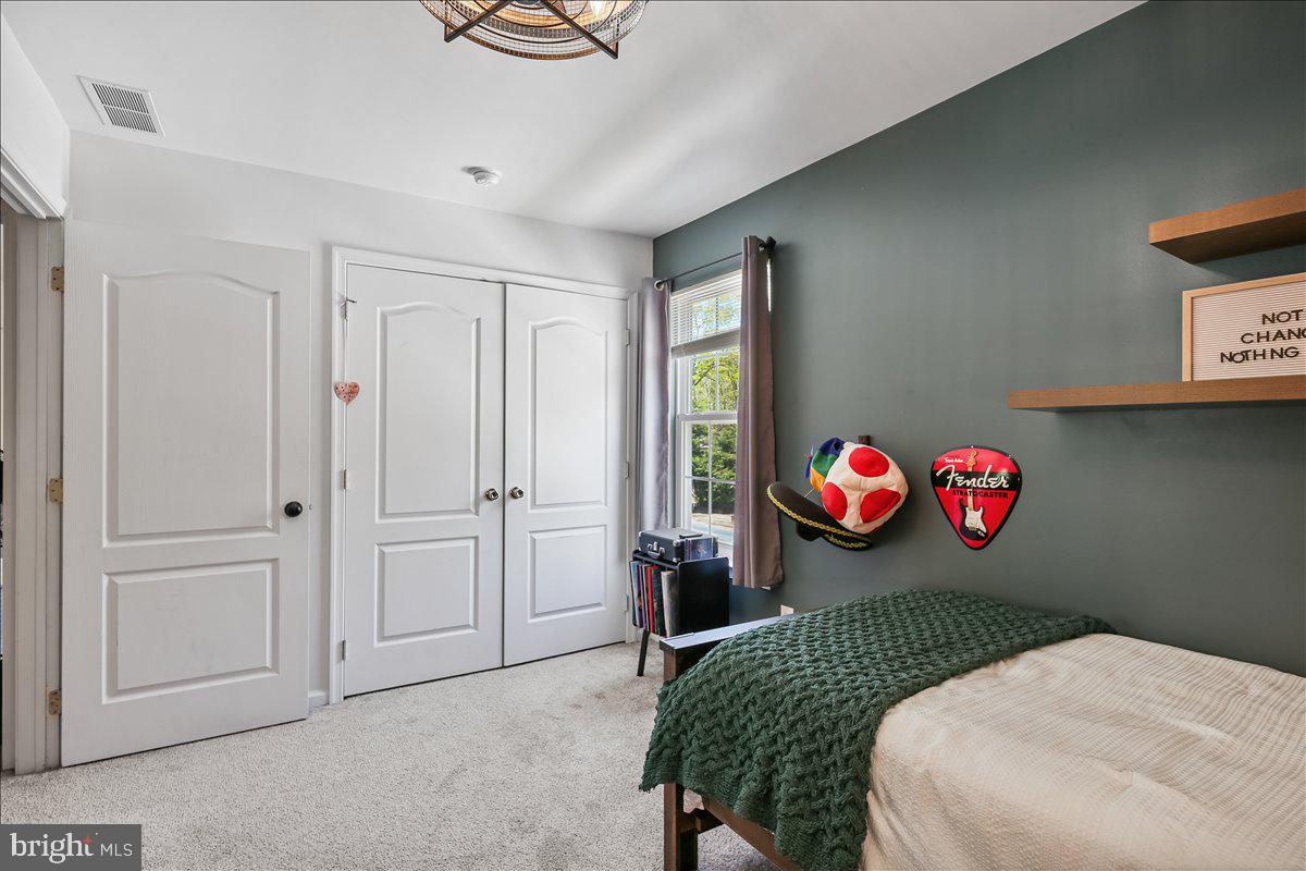201 Prancer Road Egg Harbor Township, NJ 08234 - Photo 40 of 66 a bedroom with bed and a table