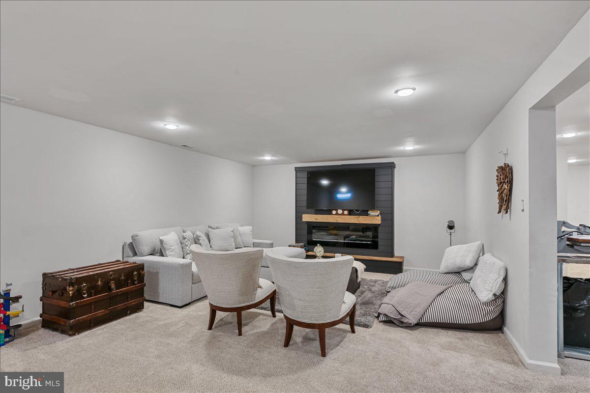 201 Prancer Road Egg Harbor Township, NJ 08234 - Photo 43 of 66 a living room with furniture and a flat screen tv
