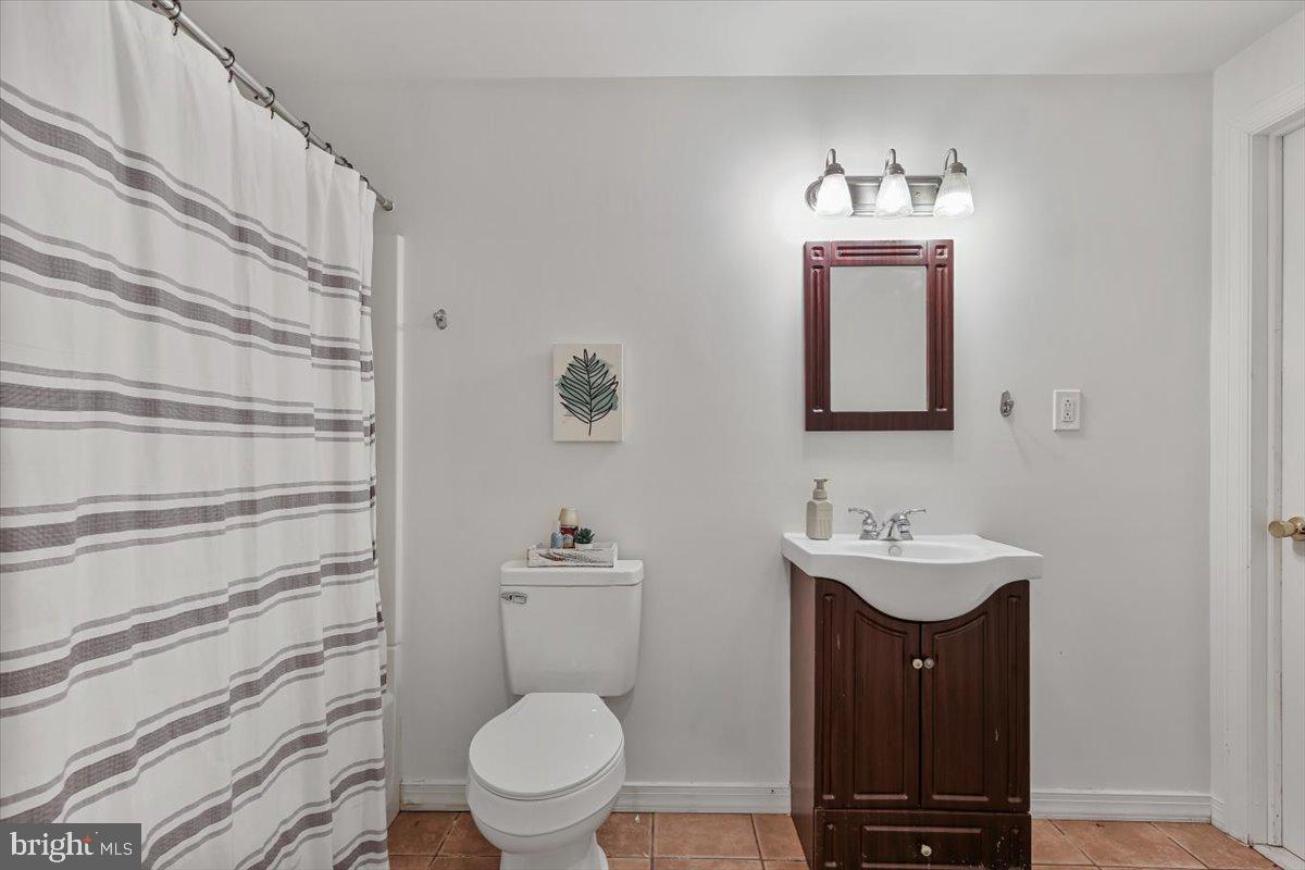 201 Prancer Road Egg Harbor Township, NJ 08234 - Photo 46 of 66 a bathroom with a toilet a sink and mirror