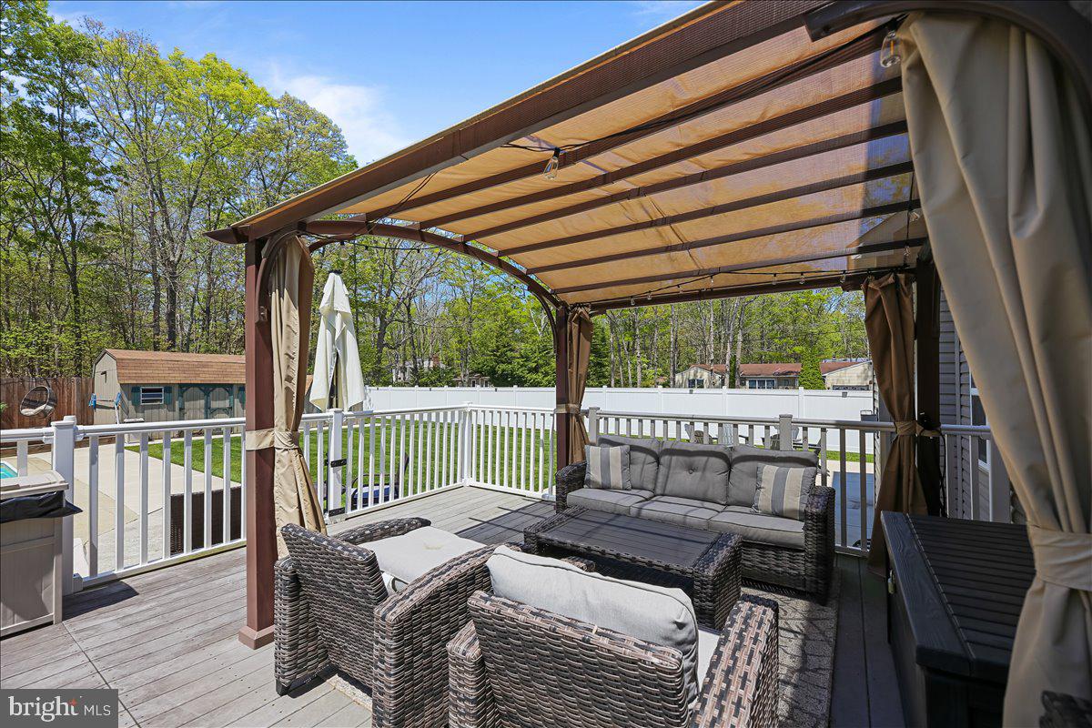 201 Prancer Road Egg Harbor Township, NJ 08234 - Photo 49 of 66 a view of balcony with wooden floor and outdoor seating