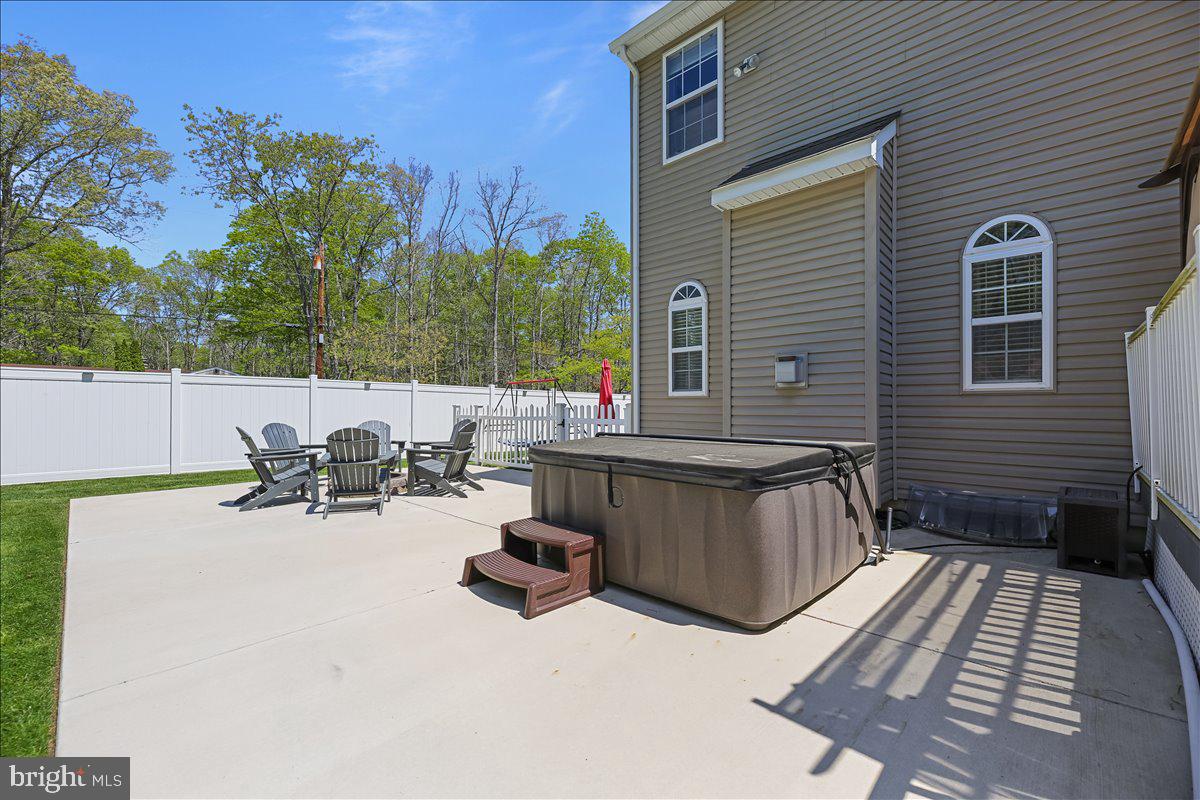 201 Prancer Road Egg Harbor Township, NJ 08234 - Photo 54 of 66 a view of a patio with a table and chairs and couches