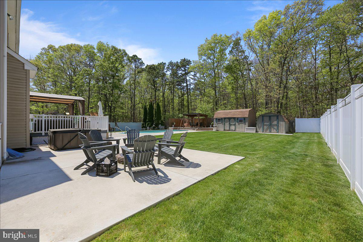 201 Prancer Road Egg Harbor Township, NJ 08234 - Photo 57 of 66 a view of a patio with table and chairs potted plants with wooden fence