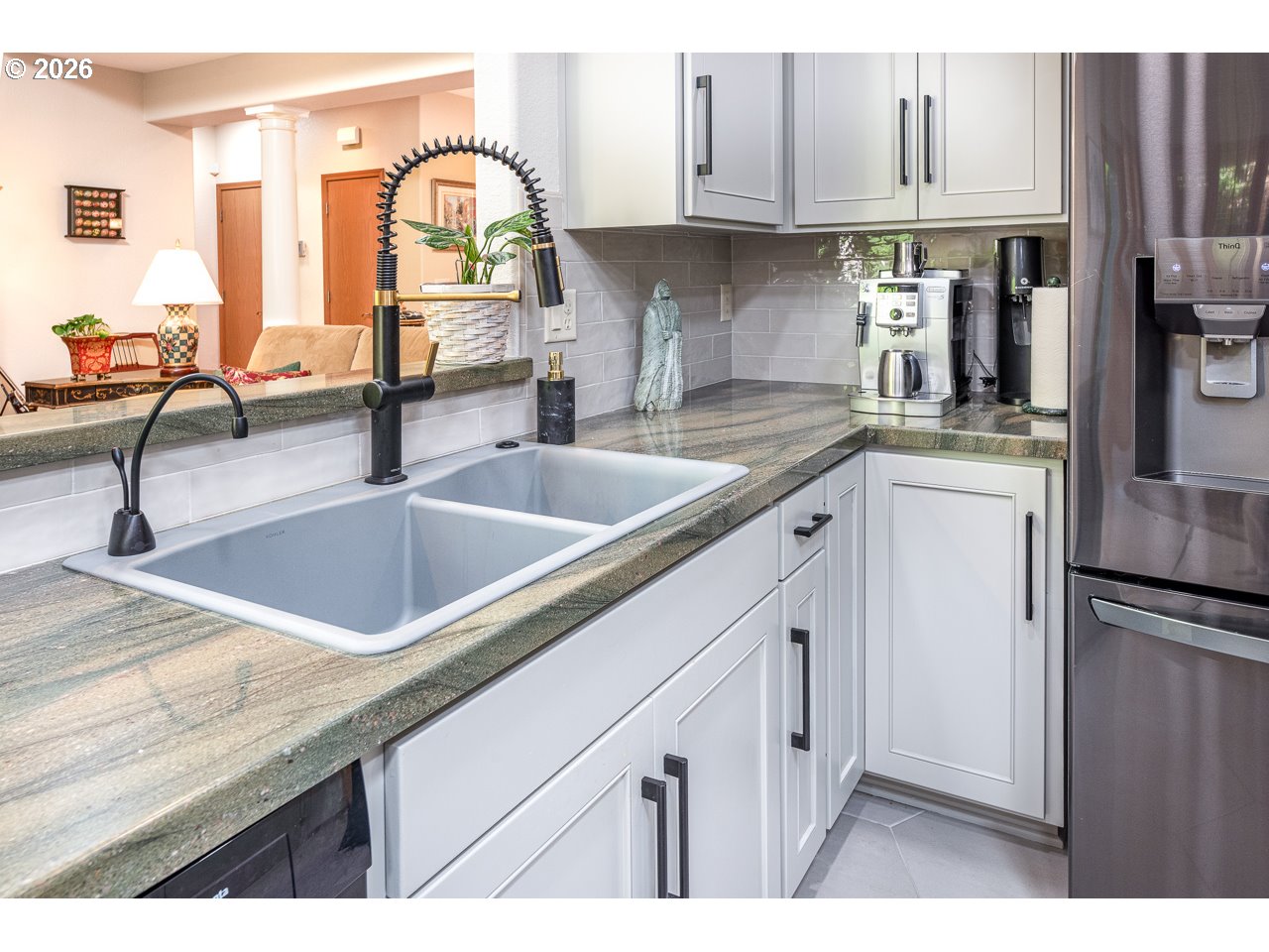 3381 Rosemont Way Eugene, OR 97401 - Photo 18 of 45 a kitchen with stainless steel appliances granite countertop a sink dishwasher and cabinets with wooden floor
