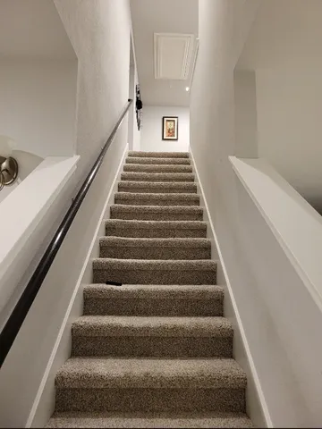 a view of house with backyard