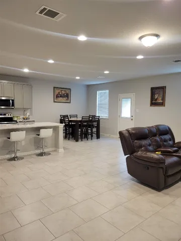 a kitchen with stainless steel appliances granite countertop a sink and cabinets