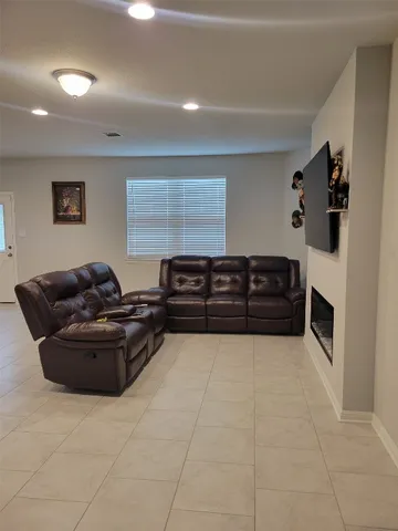 a living room with flat screen tv