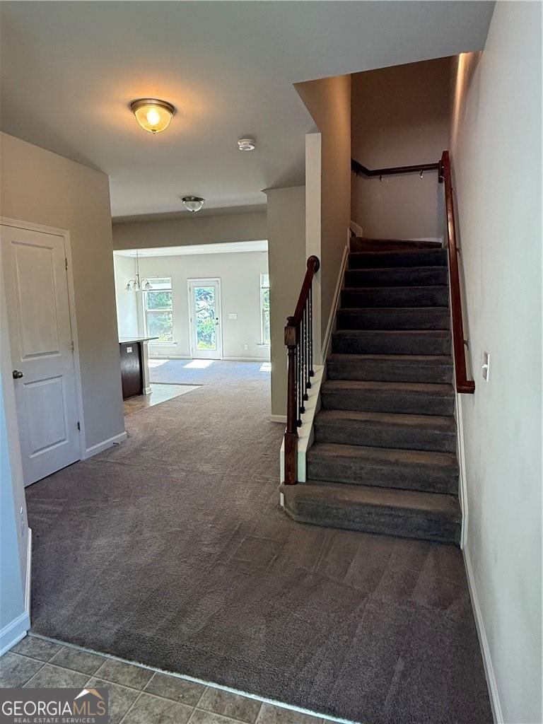 149 Hardy Water Drive Southeast Lawrenceville, GA 30045 - Photo 8 of 8 a view of a hallway with stairs