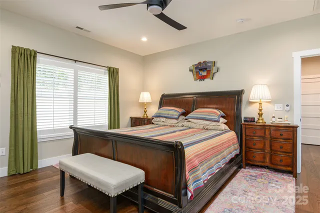 a bedroom with a bed and a table