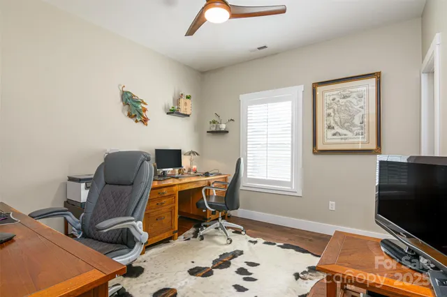 a workspace with furniture and window