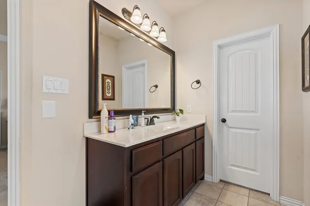 a bathroom with a tub shower and window