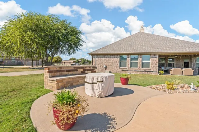 a view of a swimming pool with a yard