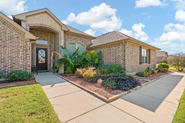 an aerial view of a pool and an outdoor seating