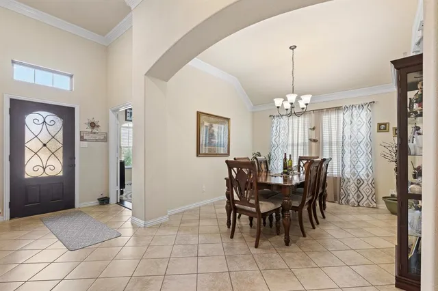 a view of a dining room with furniture and window
