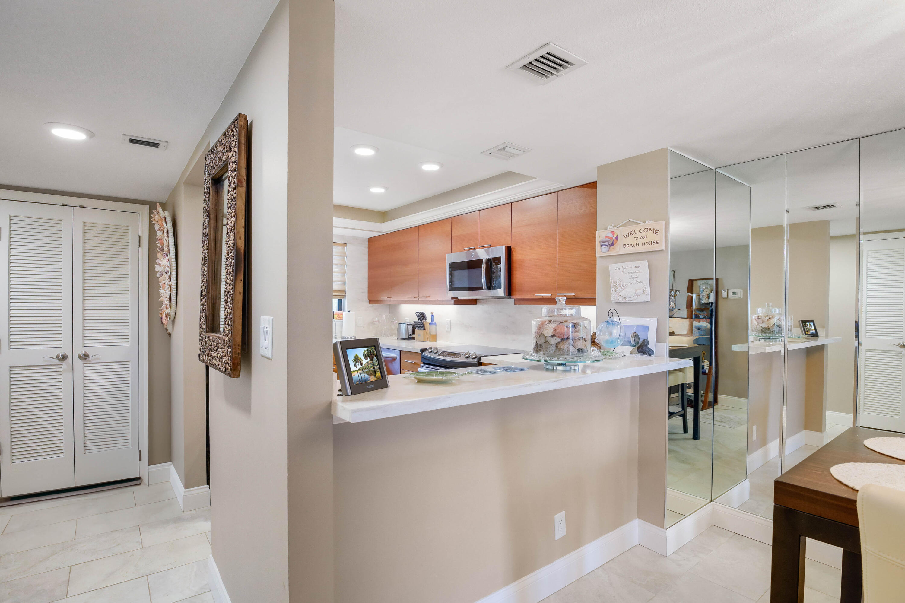 420 Celestial Way, Unit 204 Juno Beach, FL 33408 - Photo 12 of 35 KIT.OPEN TO LIVING