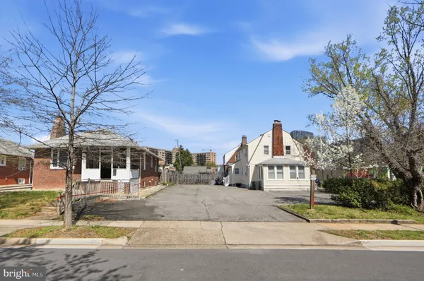 a view of a town with large trees
