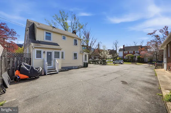 a street view with a car parked on the road