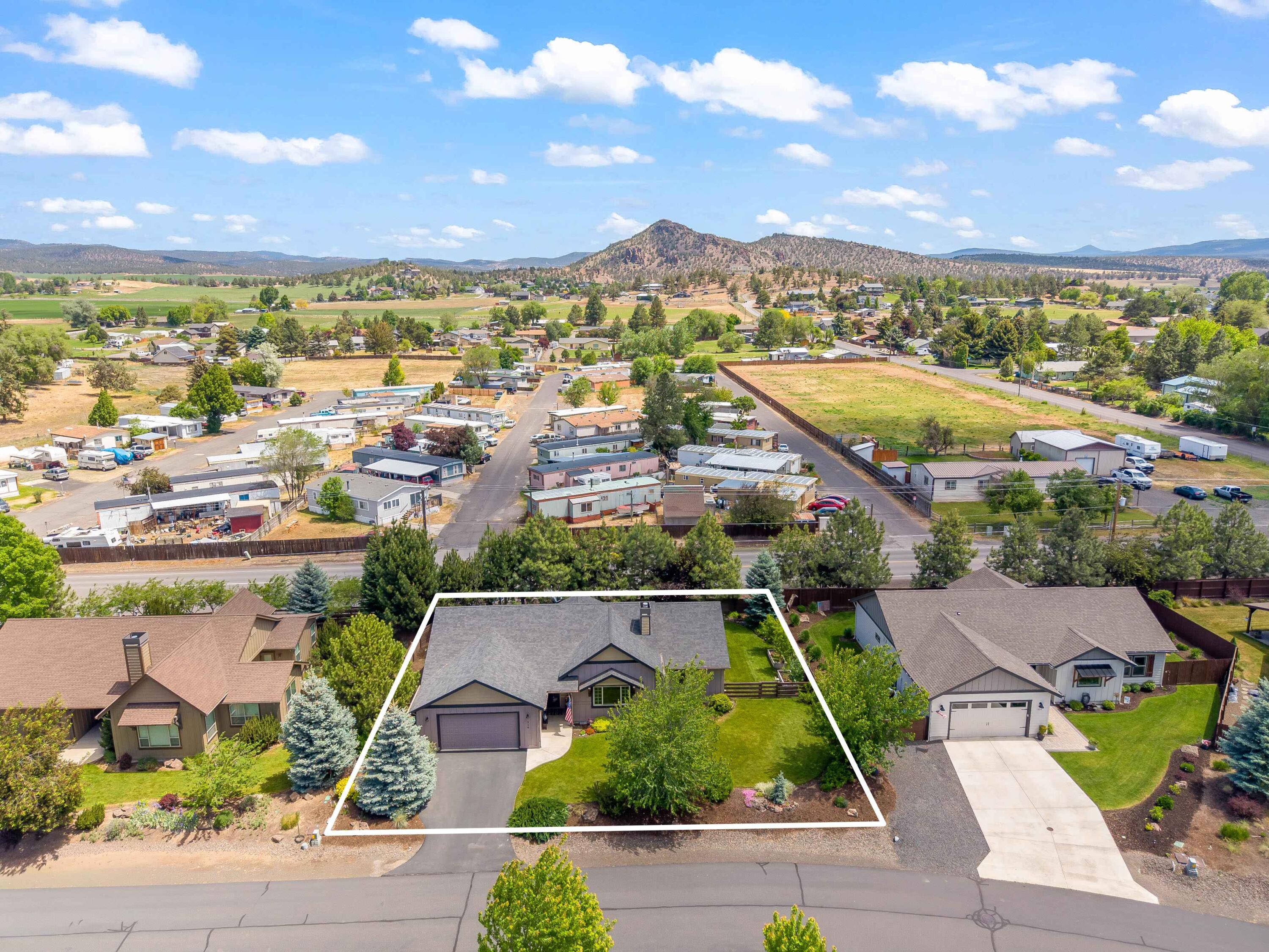 210 Northwest Saddle Ridge Loop Prineville, OR 97754 - Photo 36 of 38 an aerial view of residential houses with outdoor space and street view