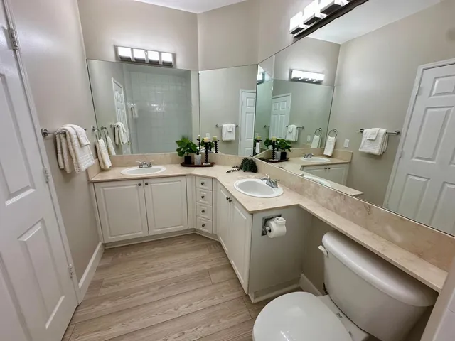 a view of a bathroom with sink and mirror