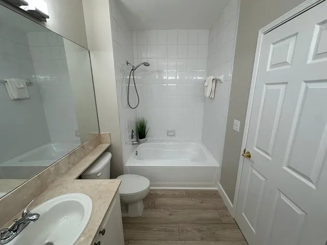 a bathroom with a sink a toilet and a bathtub