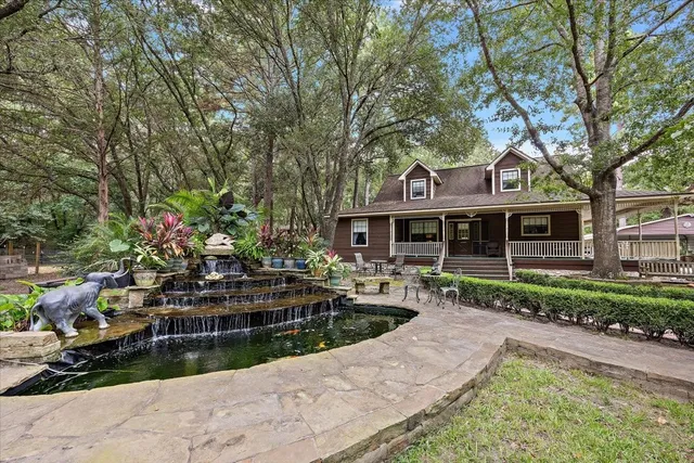 a front view of house with yard and green space