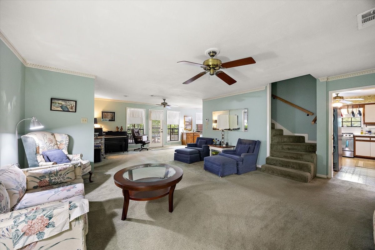 450 Four Notch Road Huntsville, TX 77340 - Photo 11 of 49 a living room with furniture and a chandelier