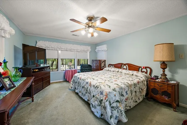 a bed room with a bed and a lamp