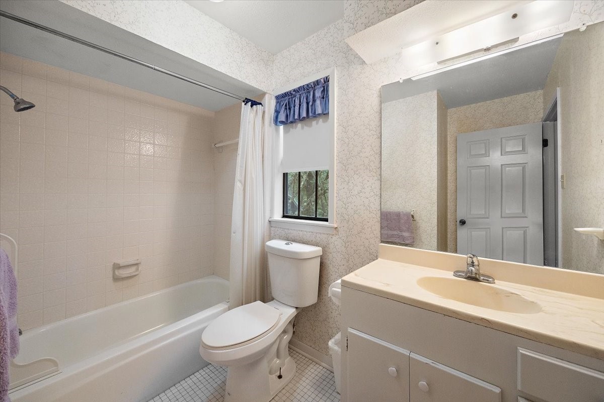 450 Four Notch Road Huntsville, TX 77340 - Photo 24 of 49 a bathroom with a sink toilet tub and shower