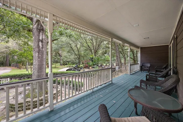 a view of a balcony with chairs