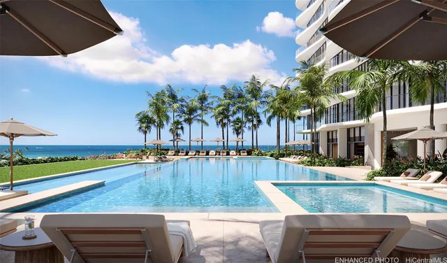 a view of a swimming pool with a patio and a yard