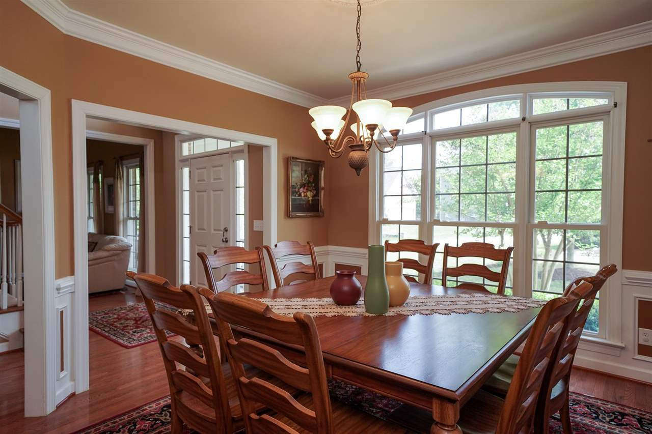 Formal Dining Room to the left when you walk in the front door. There is a small hall with powder room that connects the dining room to the kitchen. Dining Room
