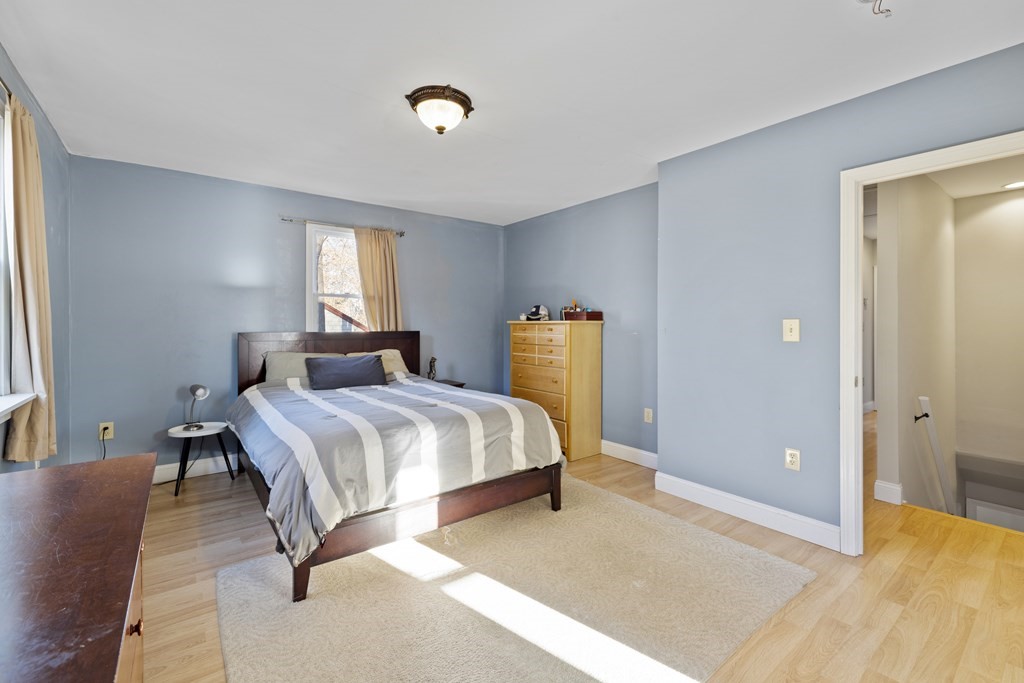 4 Bennett Road Marblehead, MA 01945 - Photo 11 of 19 a bedroom with a bed and window