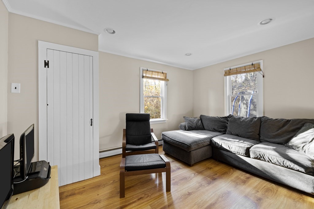 4 Bennett Road Marblehead, MA 01945 - Photo 9 of 19 a living room with furniture a flat screen tv and a window